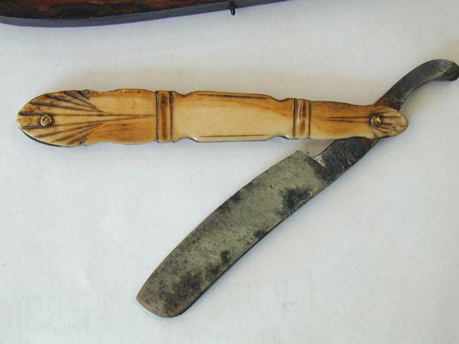 A 19th century Straight Razor with Carved Bone Handle and Original Wooden Carrying case — image 2