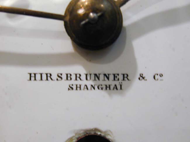A late 19th century Ship's Bulkhead Clock signed "Hirsbrunner & Co., Shanghai" — image 2