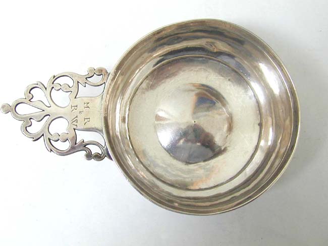 A RARE AMERICAN SILVER PORRINGER BY ELPHALET LORING, SR., BARNSTABLE, CAPE COD, MASS., CIRCA 1765