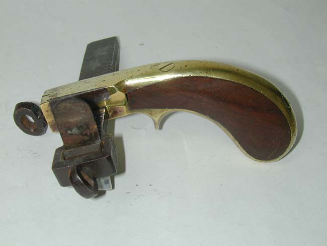A 19th century American Pistol Form Leather Belt Cutting Tool circa 1870