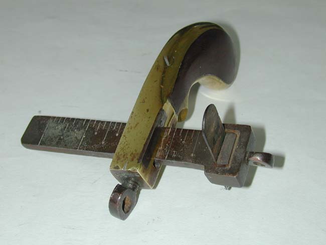A 19th century American Pistol Form Leather Belt Cutting Tool circa 1870 — image 2
