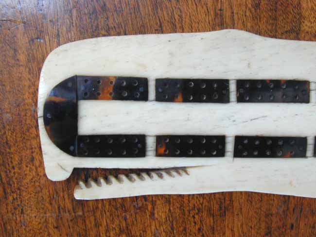 A charming 19th century   Cribbage Board carved from a whales' jawbone and inlaid with tortoiseshell   — image 2