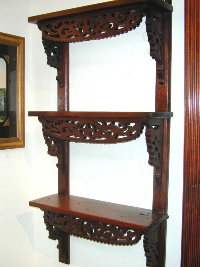 A Civil War Era Carved Walnut Three-Tiered Shelf circa 1860-1870