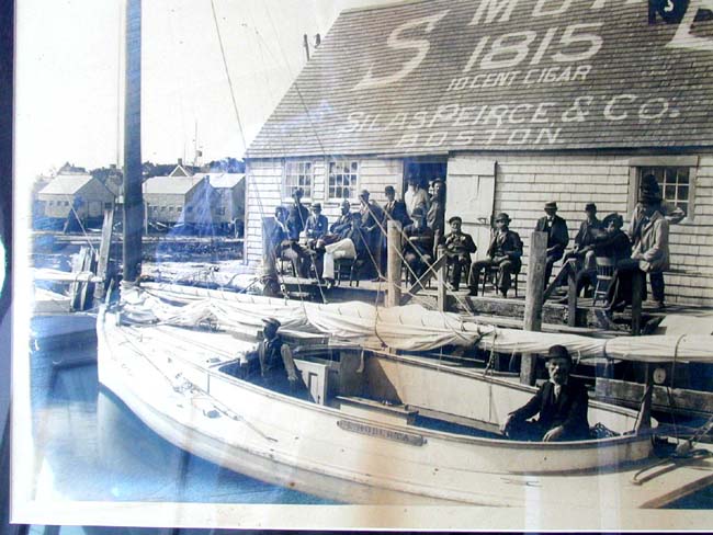 A Rare Original Photograph of Two Men in a Catboat docked at the Silas Peirce & Co. Dock in Nantucket circa 1880