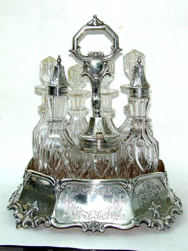 An Attractive English Engraved Silver 7 Bottle Cruet Set by George Angell, London, 1855