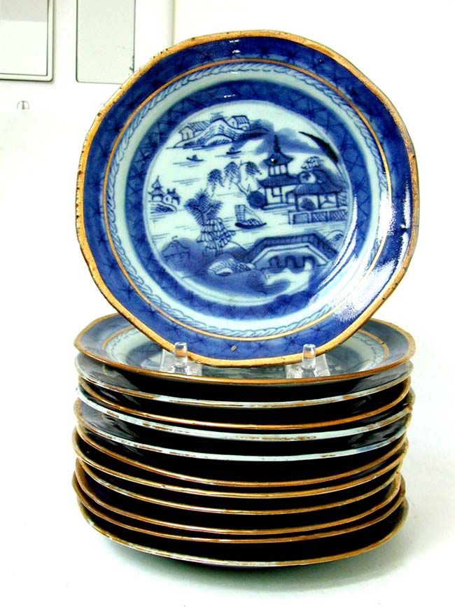 A Rare set of 12 early 19th century Chinese Export Porcelain Canton 6" saucers with shaped Edges and gilt highlights