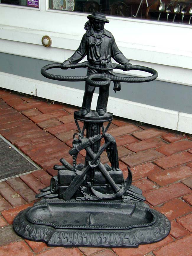 An Early 20th century Black Painted Cast Iron 'Sailor' Umbrella Stand