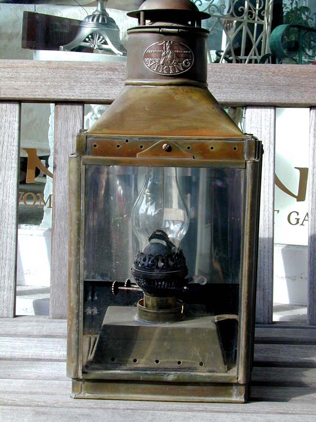 A Late 19th century ship's Cabin Lamp signed VIKING with original burner and having a beautiful dark patina.
