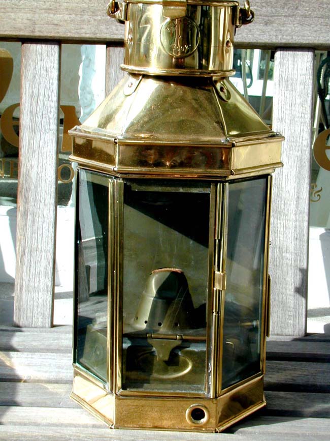 A Magnificent British made Ship's Bulkhead Lamp of the highest quality and dated 1902.