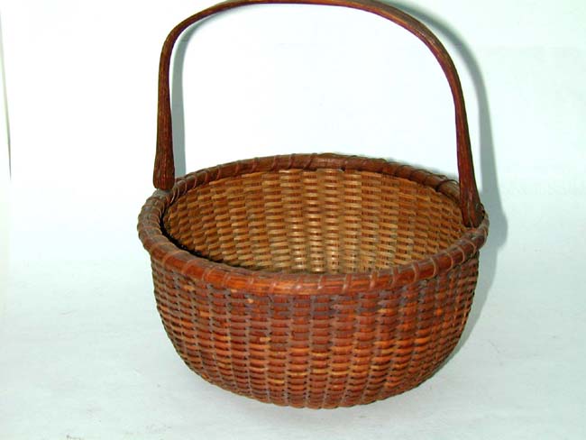 A Late 19th century swing handle Nantucket Basket