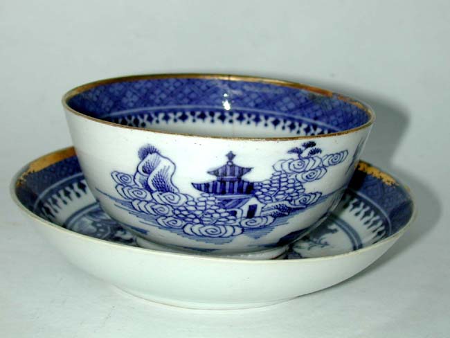 An Early 19th century 'Imperial Nanking' Cup and Saucer with Gilt Highlights