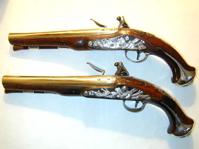 A Nice Pair of Silver-Mounted Flintlock Holster Pistols with Brass Barrels signed 'J. Henshaw, London,' one hallmarked 1749, the other 1754 — image 2