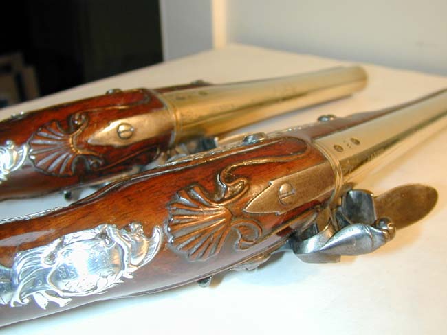 A Nice Pair of Silver-Mounted Flintlock Holster Pistols with Brass Barrels signed 'J. Henshaw, London,' one hallmarked 1749, the other 1754 — image 3