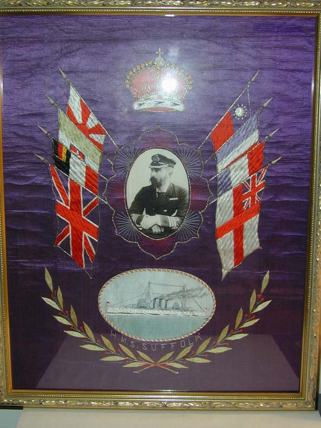A Fine Sailor's Silkwork Featuring a Depiction of H.M.S. SUFFOLK and a photo of the Ship's Captain circa 1930