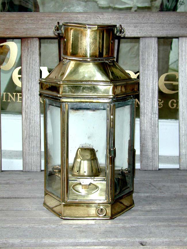 A Ship's Bulkhead Lamp with original burner and rare porcelain reflective back plate by Bulpitt, circa 1902.