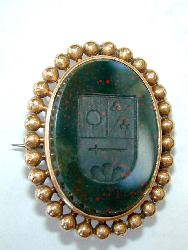 An Early 19th Century English 18 kt. Gold Mounted Bloodstone Brooch with Engraved Coat-of-Arms