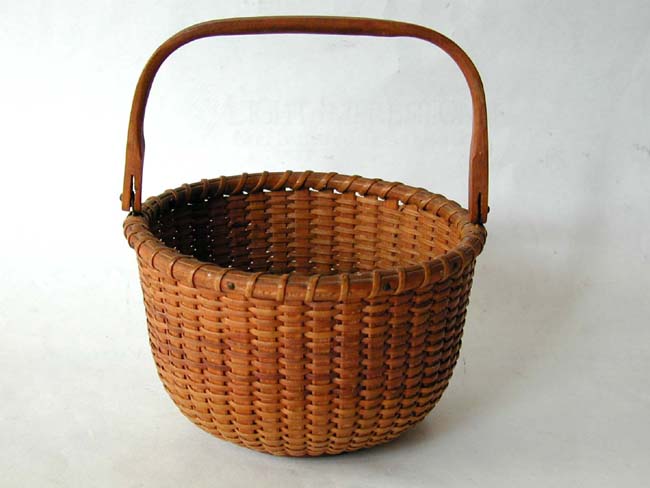 A Diminutive Nantucket Swing Handled Basket by S.P. Boyer circa 1940-1950.