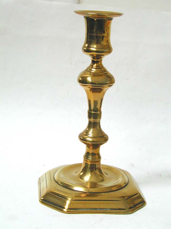 A Single 18th century Brass Candlestick circa 1750 with stepped Octagonal Base.