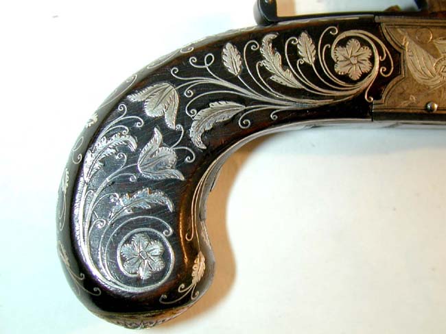 A Museum Quality Pair of Flintlock Pocket Pistols inlaid with Gold and Silver by John George Lacy, London, circa 1810-1814. — image 3