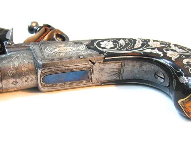 A Museum Quality Pair of Flintlock Pocket Pistols inlaid with Gold and Silver by John George Lacy, London, circa 1810-1814. — image 10