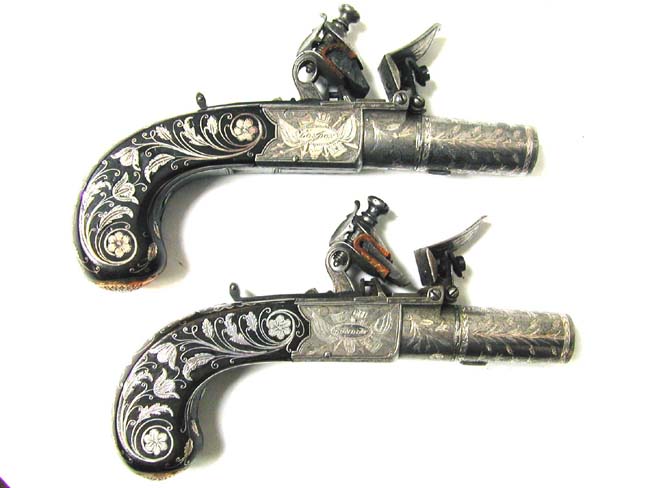 A Museum Quality Pair of Flintlock Pocket Pistols inlaid with Gold and Silver by John George Lacy, London, circa 1810-1814.