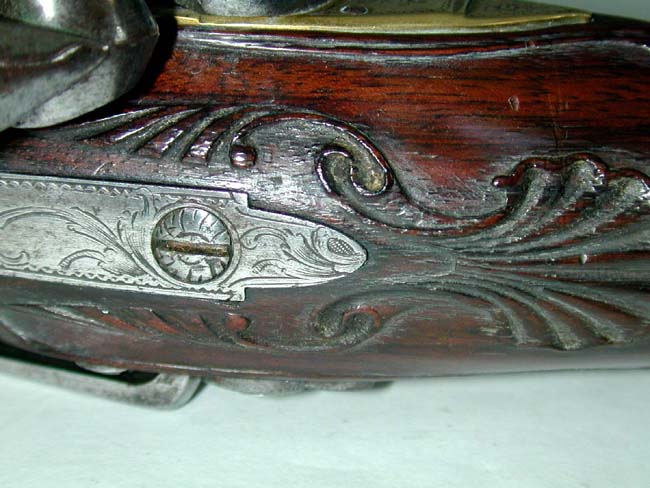 An Exceptionally fine and rare pair of English Naval Officer's Silver Mounted Brass Barrelled Flintlock Pistols by Joseph Bunney, London, 1776. — image 4