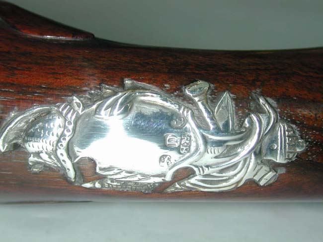 An Exceptionally fine and rare pair of English Naval Officer's Silver Mounted Brass Barrelled Flintlock Pistols by Joseph Bunney, London, 1776. — image 5