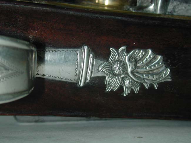 An Exceptionally fine and rare pair of English Naval Officer's Silver Mounted Brass Barrelled Flintlock Pistols by Joseph Bunney, London, 1776. — image 7