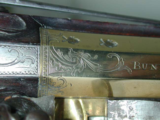 An Exceptionally fine and rare pair of English Naval Officer's Silver Mounted Brass Barrelled Flintlock Pistols by Joseph Bunney, London, 1776. — image 9