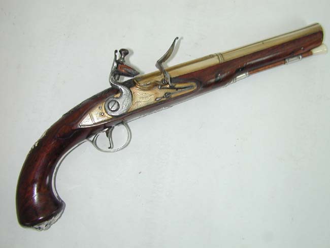 An Exceptionally fine and rare pair of English Naval Officer's Silver Mounted Brass Barrelled Flintlock Pistols by Joseph Bunney, London, 1776. — image 3