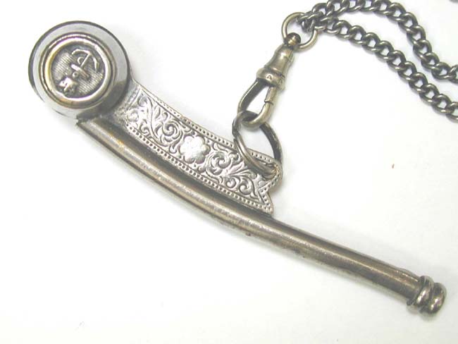 A Late 19th century British Navy Bosun's Whistle with its original 'Gunners' chain