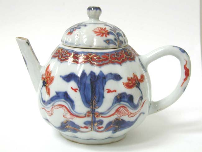 AnEarly 18th century Chinese Imari Teapot with pear shaped fluted pot with matching lid circa 1725