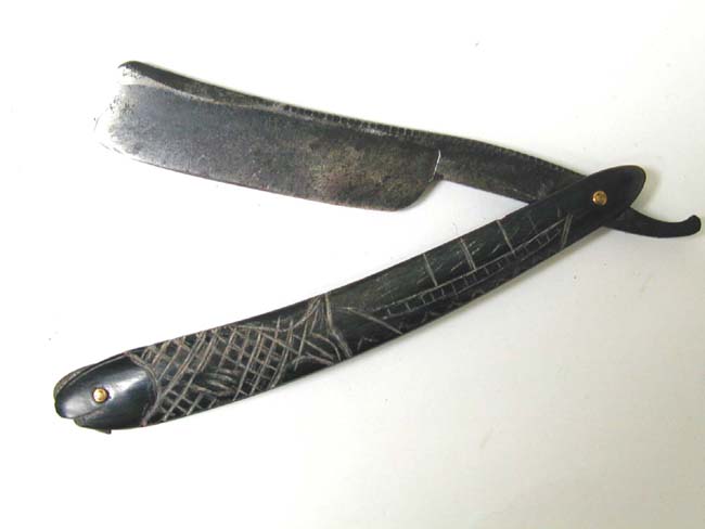 A Charming 19th century Sailor-Made Scrimshawed Baleen Mounted Straight Razor circa 1860.