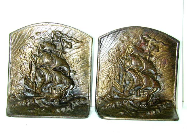 A Pair of Antique Bronze Plated Cast Iron High Relief Bookends of a 17th century Ship made by BronzeMet of New York circa 1925.