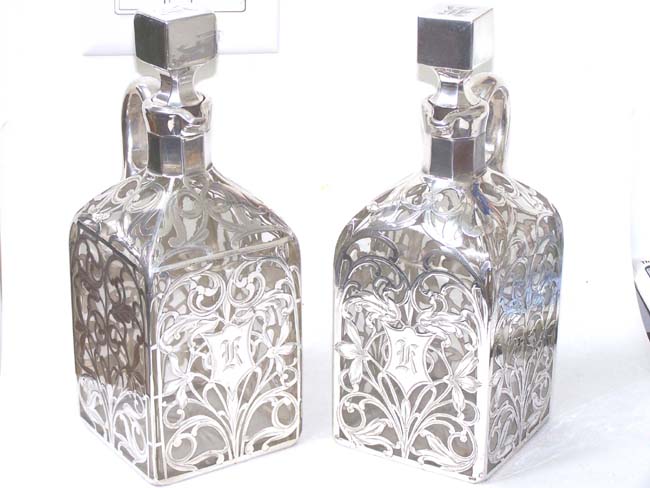 A Beautiful Pair of Late 19th century Silver Overlay Decanters with Four Matching Tumblers