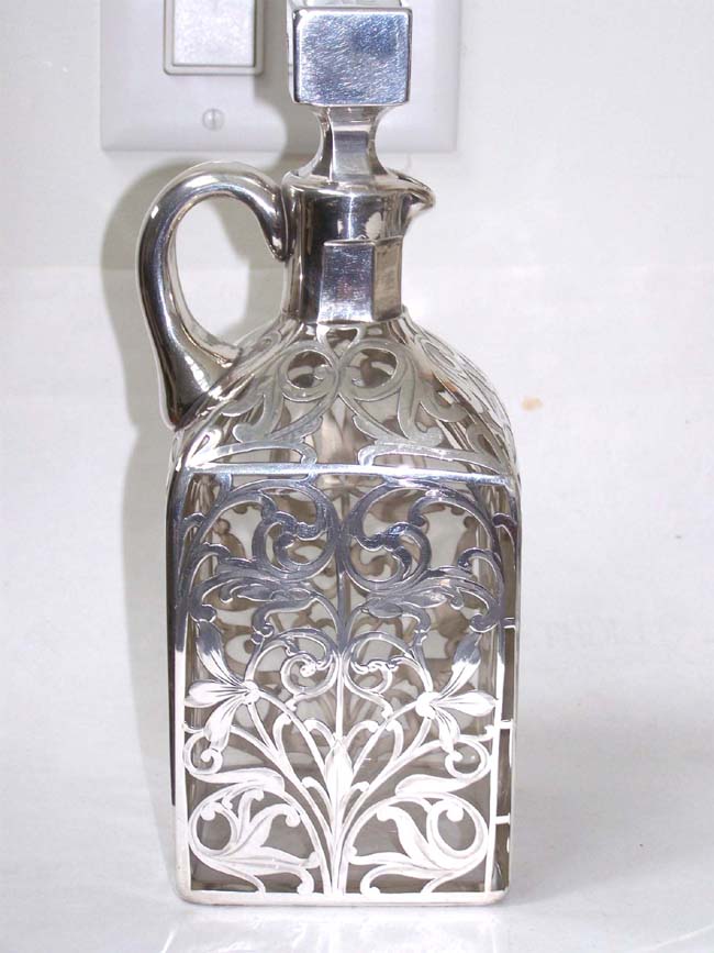 A Beautiful Pair of Late 19th century Silver Overlay Decanters with Four Matching Tumblers — image 3