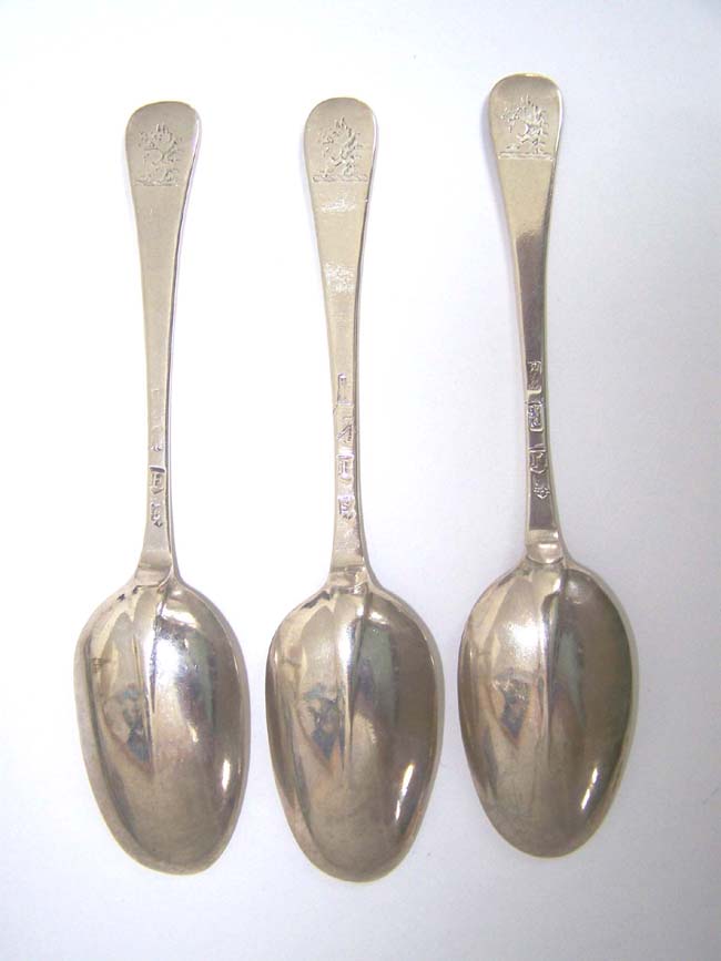 A Set of Three English Silver Rat-Tail Tablespoons by William Scarlett, London, 1720-21, with Boar's head crest.