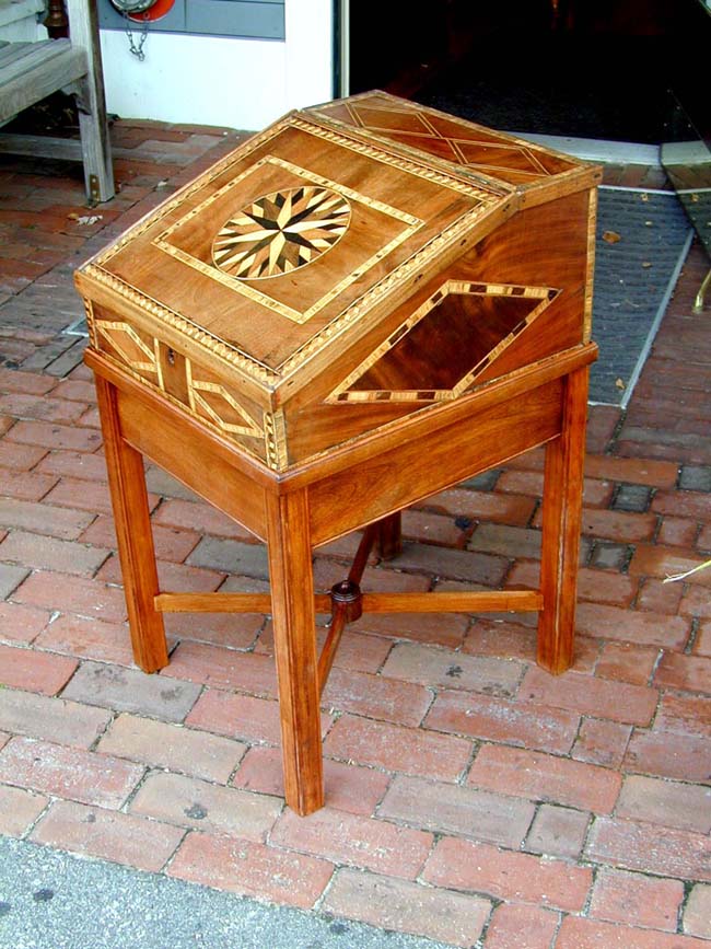 A 19th century Sea Captain's Writing box with inlaid compass rose on the lid.