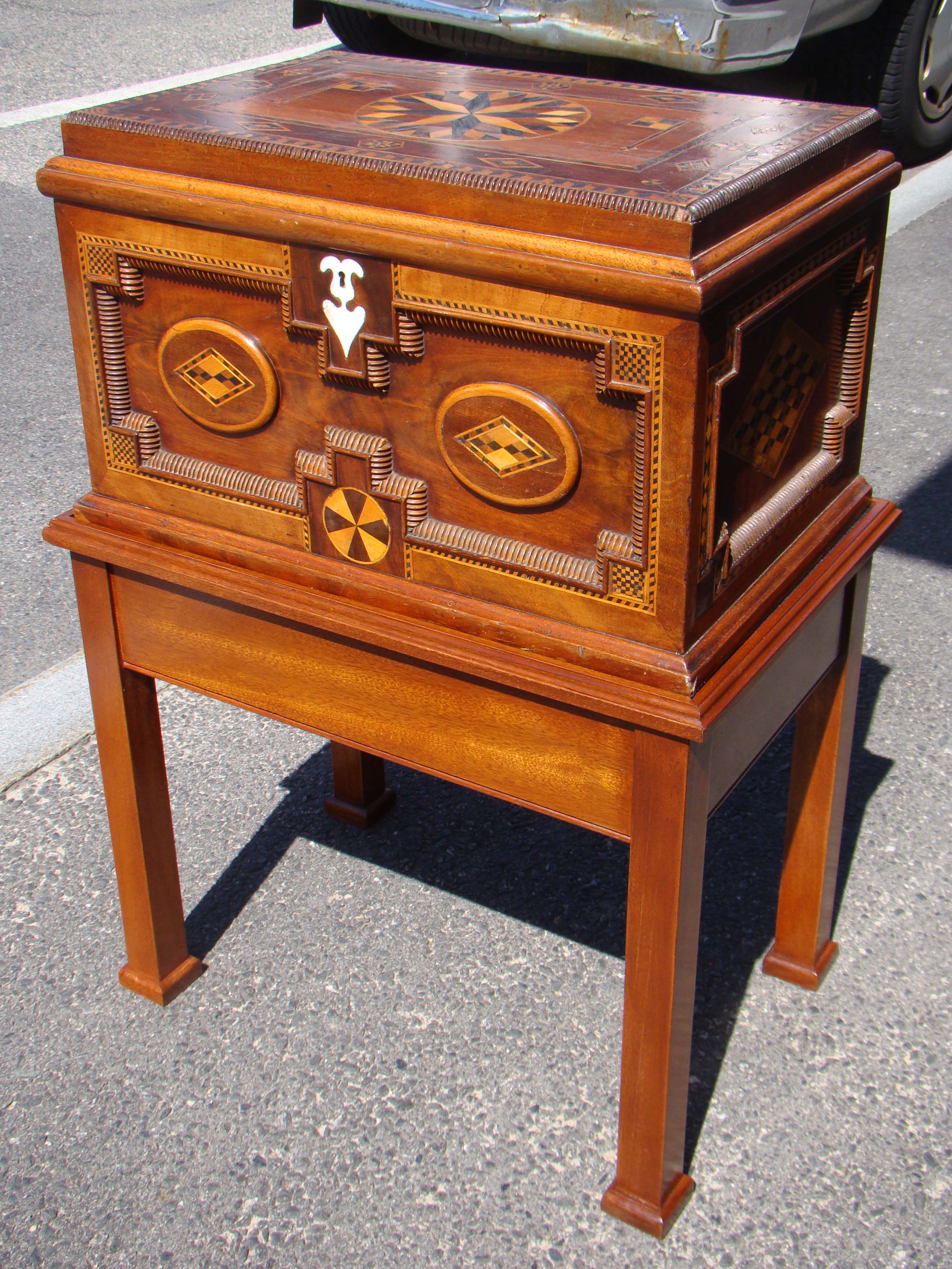 A FABULOUS 19th century British sailor-made walnut chest with applied moldings, fruitwood inlays and a whalebone keyhole escutcheon circa 1865-1880.