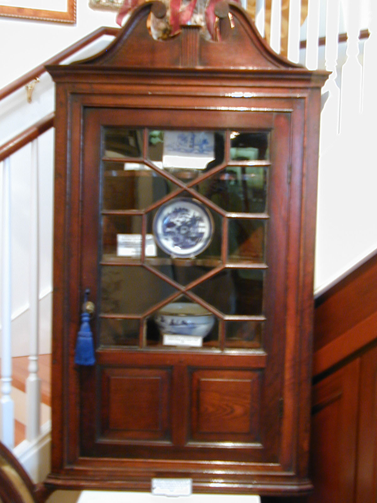 An 18th Century English Oak Chippendale Style Corner Cupboard With Glazed and Panelled Door