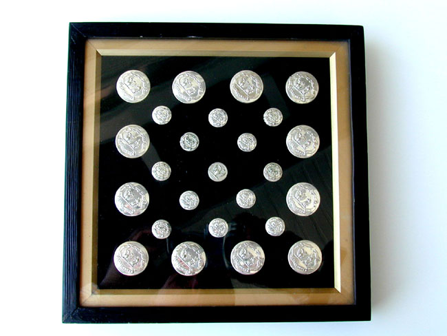 A Fine and Rare Grouping of 19th Century English Footman's Silver Livery Buttons.