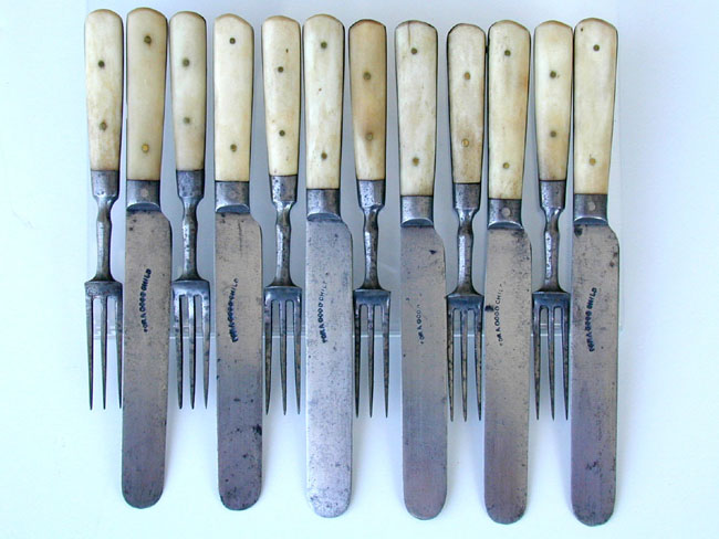 A 19th century Set of Children's Bone Handled Forks and Knives stamped "For a Good Child" circa 1850