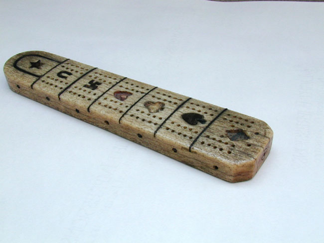 A 19th Century Sailor-Made Whalebone Cribbage Board With Baleen Inlays