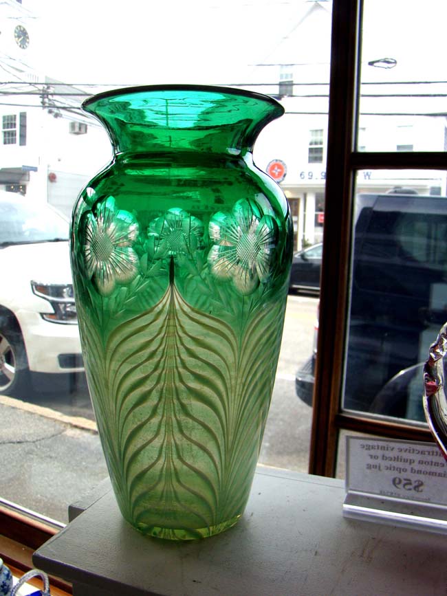 A gorgeous vintage emerald green cut glass art deco vase