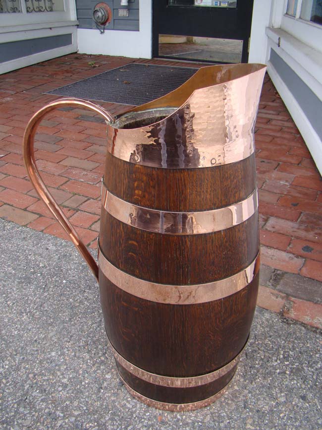 A beautiful French copper bound oak jug dated 1933
