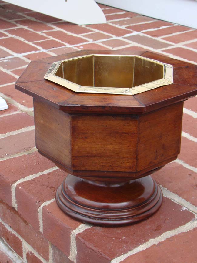 A GORGEOUS  English octagonal shaped mahogany planter or wine cooler with brass liner circa 1870.