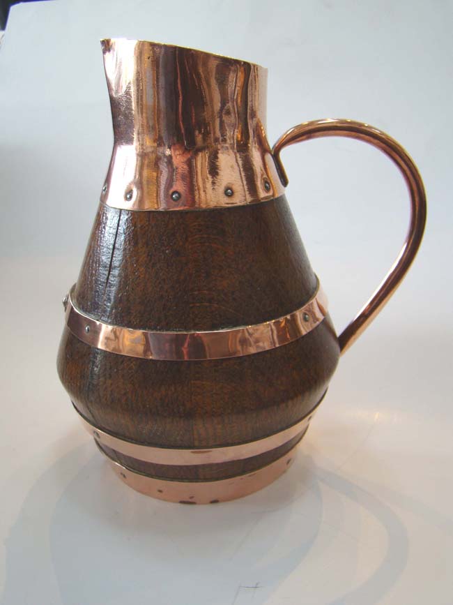 A charming 19th century English copper bound oak 'cider' jug from the Devon region of England circ