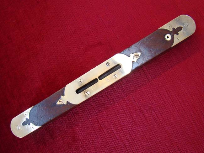 An exceptionally fine English brass mounted mahogany level circa 1890