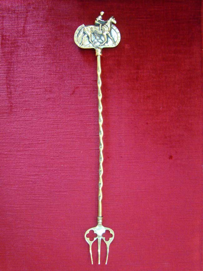 A fine late 19th century English brass 'toasting' fork with Horse & Rider handle