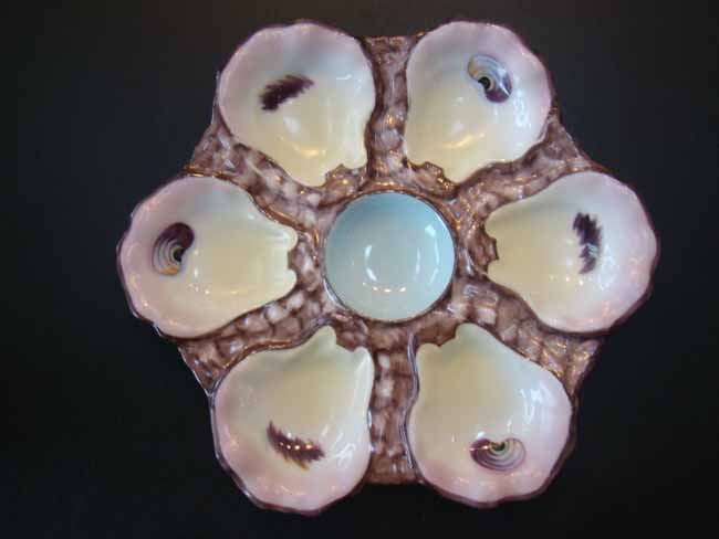 A very attractive hand painted bone china oyster plate circa 1875-1890